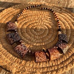 Hand Carved Bone necklace with unique geometric pattern and two tone beading